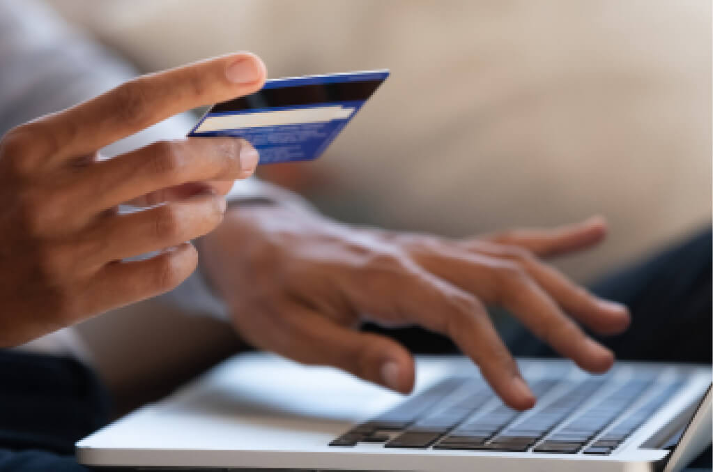 Credit card next to a computer